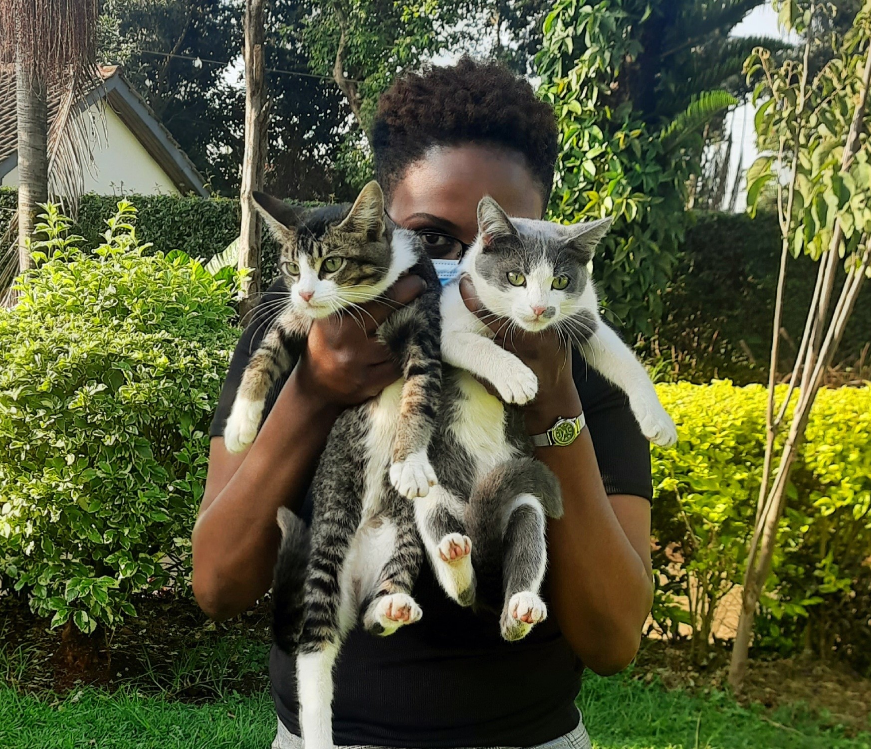 Cess and her two cats, Luna and Suss (late).