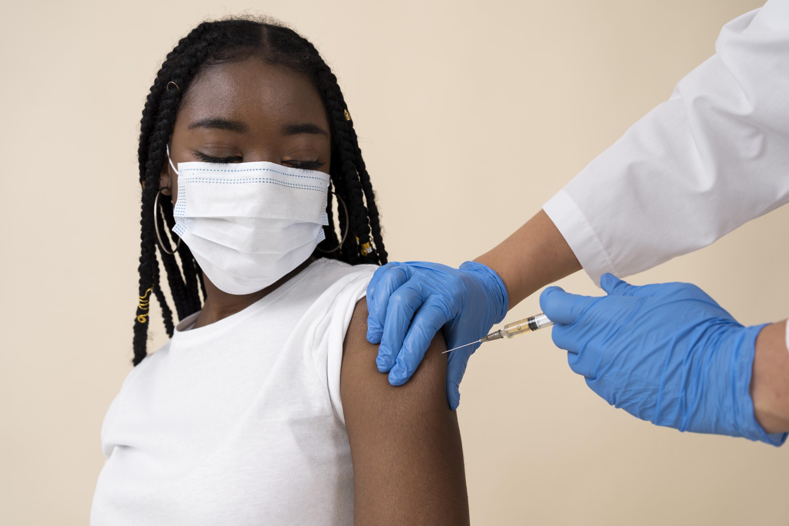 A woman being vaccinated.